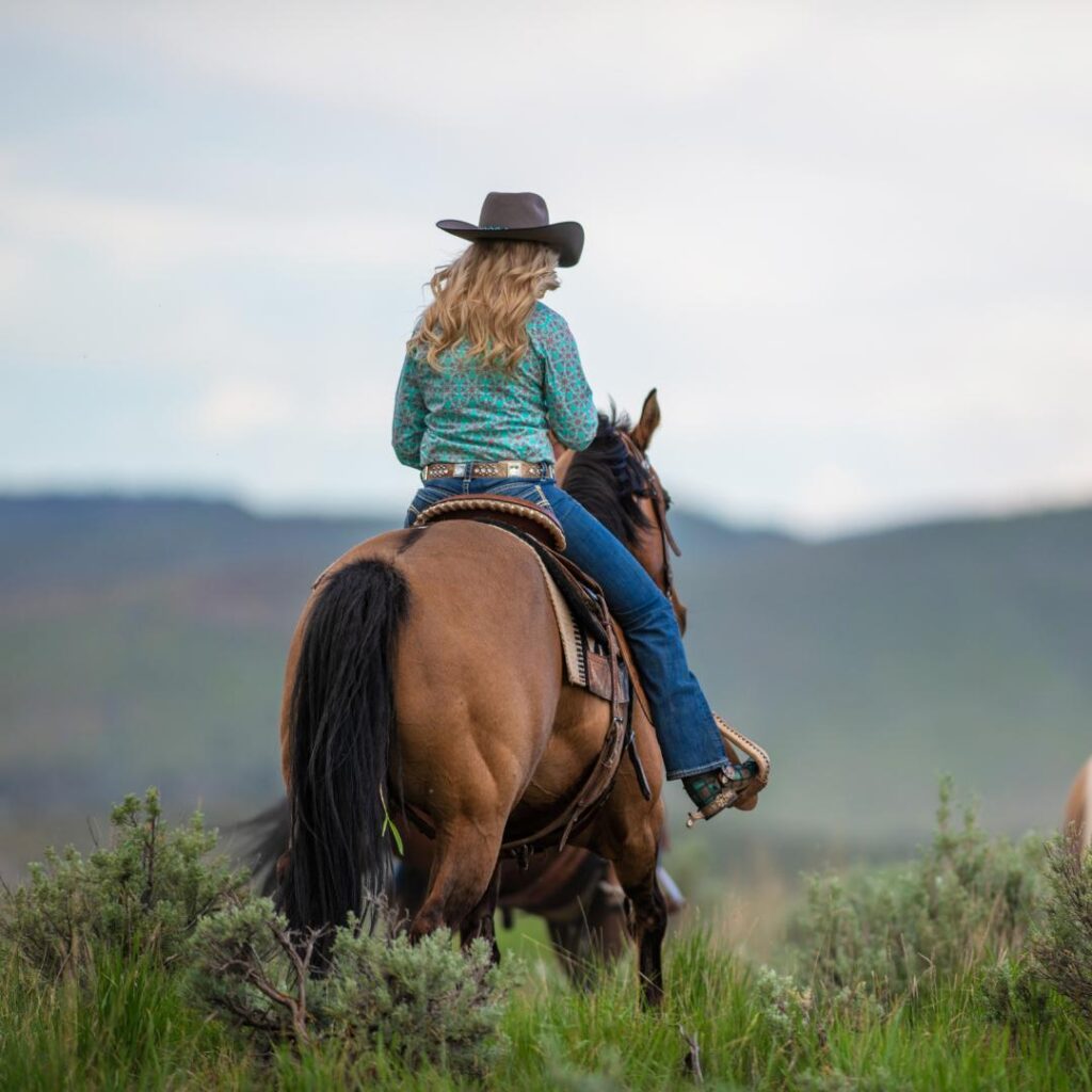 Blonde woman on a horse