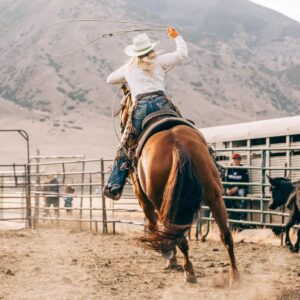 A girl galloping on a horse