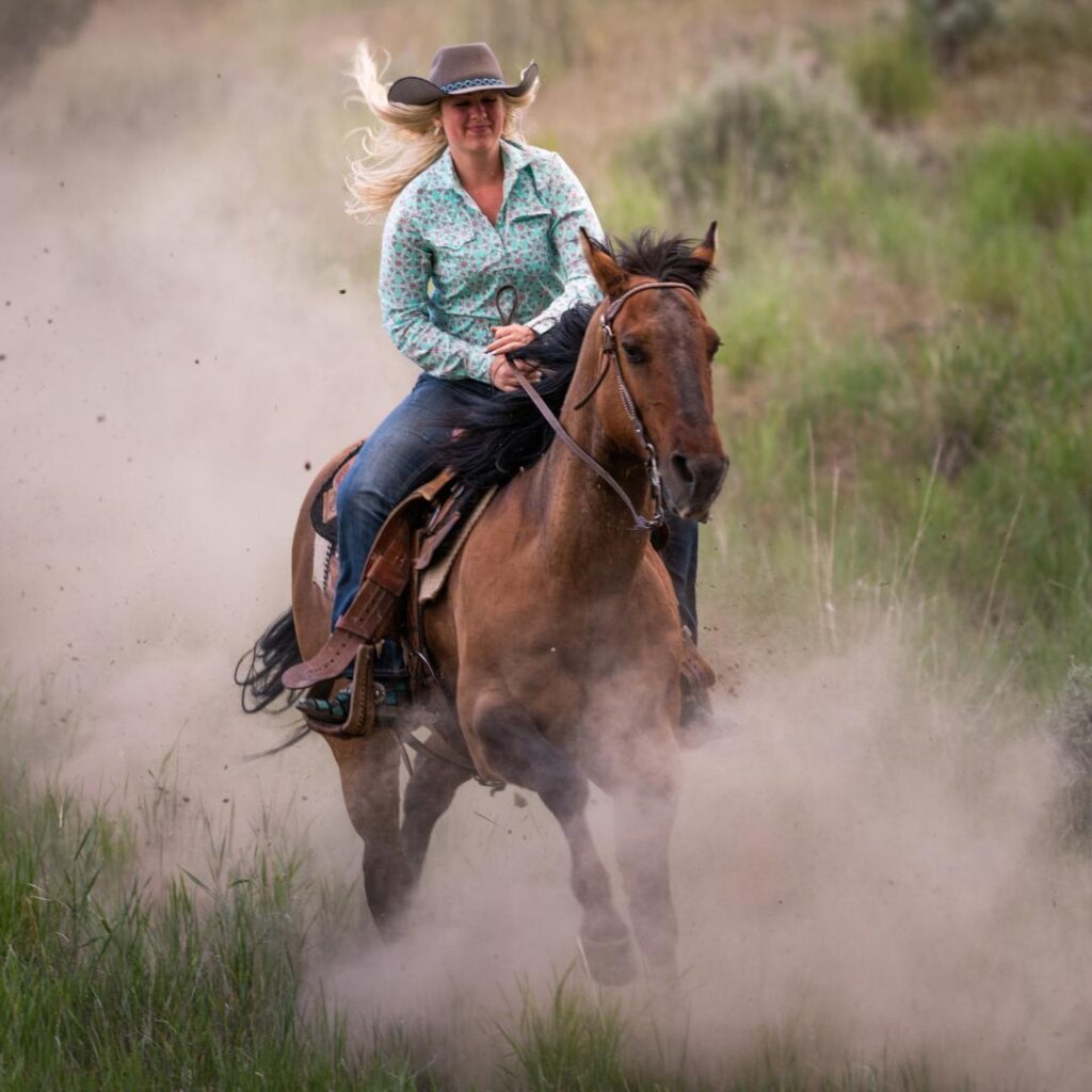 A woman galloping a horse