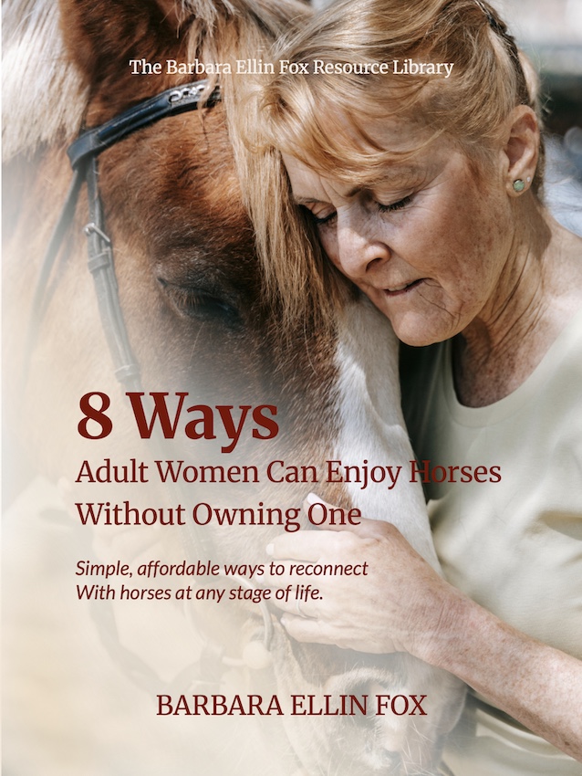 A woman resting her head on a horse's forehead